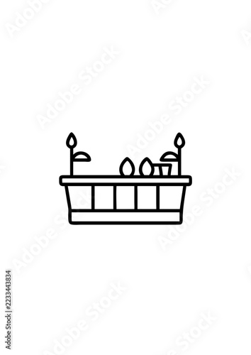Small rectangular planter box with growing sprouts and leaves