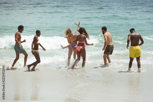 Group of friends enjoying at beach