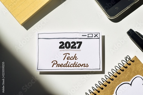 2027 Tech Predictions inscription on hand drawn web browser white paper on office desk. 2027 Year trends, expectations on technology artificial intelligence concept. View from above.