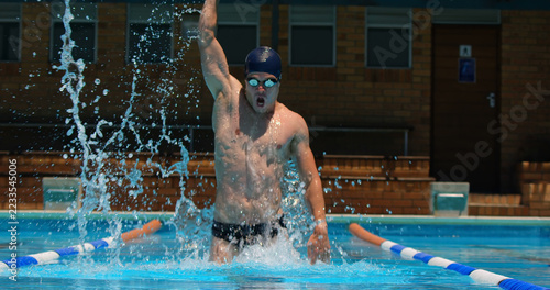 Obraz na plátně Male swimmer react after winning the race