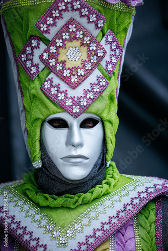 Obraz na plátně Venice, Italy - February 12, 2026: Venice Carnival masked figure in white face m