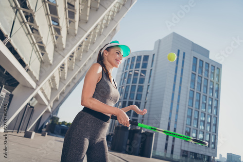 Profile side photo of lady professional coach teach people play tennis serve racquet ball wear crop top outdoors