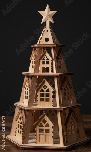 shot handcrafted wooden erzgebirge christmas pyramid dark moody background single soft highlight illuminating