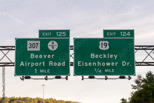 signs on I-64 in West Virginia - Exit 125 for WV-307 and County Route 9/9 toward Beaver and Airport Road, and Exit 124 for US-19 to Beckley and Eisenhower Drive