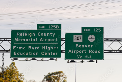 signs on I-64 in West Virginia - Exit 125 for WV-307 and County Route 9/9 toward Beaver and Airport Road, and Exit 125B for Raleigh County Memorial Airport and the Erma Byrd Higher Education Center