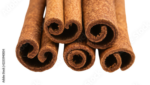 Fotografie Isolated aromatic cinnamon sticks close up, perfect for culinary use, baking, an
