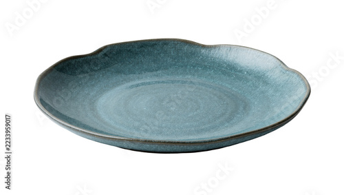 Fotografie Isolated elegant blue-green ceramic dinner plate with an organic wavy rim design