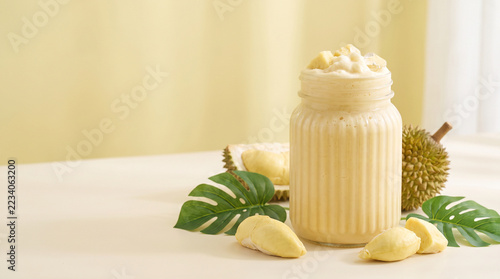 Tropical coconut dessert with pineapple and green leaves arranged on a warm cream surface for refreshing summer food styling inspired by natural ingredients island cuisine and healthy indulgence