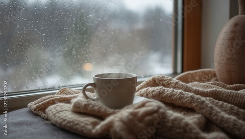 Close-Up of a Hot Espresso Cappuccino in a White Cup with Chocolate Pastries on a Café Table During Early Morning Breakfast, Rich Aroma and Cozy Coffee Atmosphere