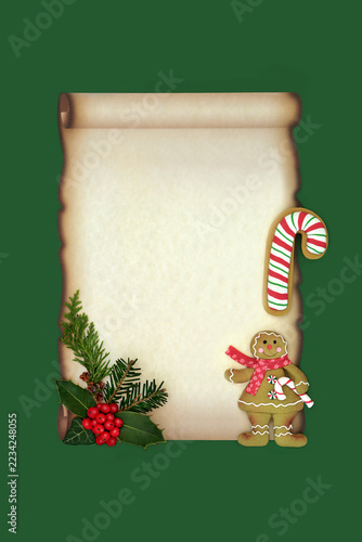 Christmas gingerbread cookies, winter berry holly with flora on paper scroll on green. Old fashioned design for letter to santa or party invitation.