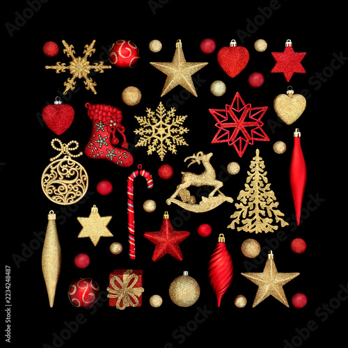 Red, gold Christmas tree sparkling decorations and ornaments on black background. Collection of decorative symbols for the holiday season, greeting card.