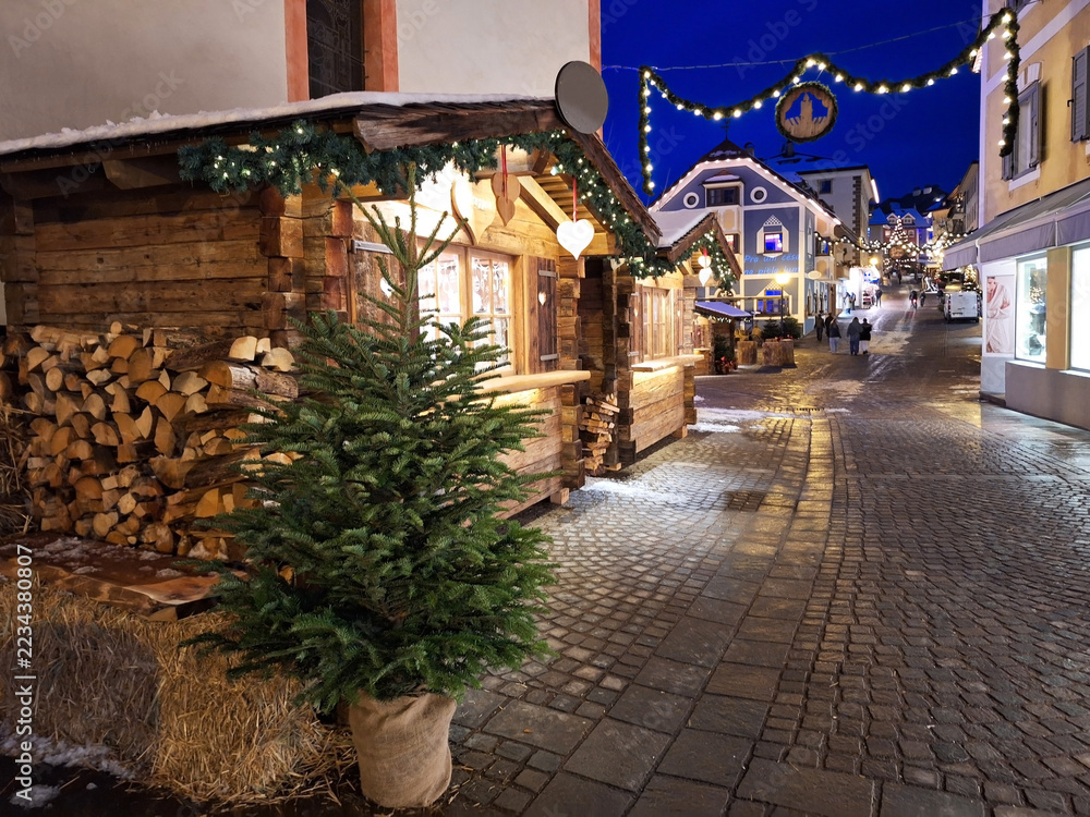 Fototapeta premium The town of Ortisei at night on a winter Christmas evening.