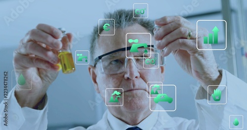 Inspecting scientist holding two vials in lab, wearing lab coat, safety glasses, tie, with AR icons