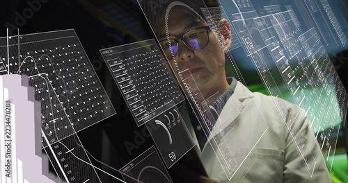 Scanning lab-coated researcher with glasses viewing translucent HUDs in dim lab, holding tablet