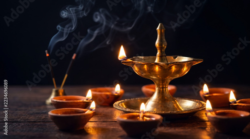 Golden Diya Flame Illuminating a Dark Festive Background