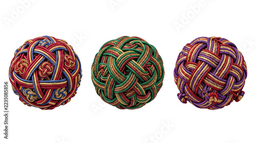 Three decorative japanese temari balls made of colorful interwoven silk threads, featuring intricate geometric knot patterns on white background