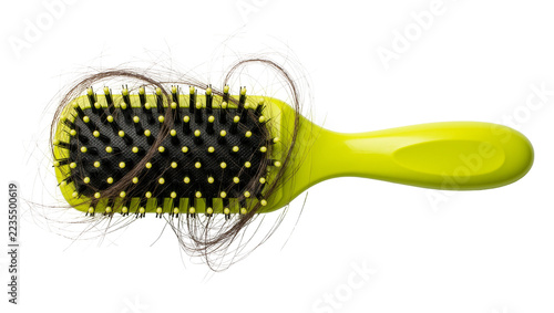 Obraz na plátně Lime green hair brush with tangled brown hair strands stuck in black bristles