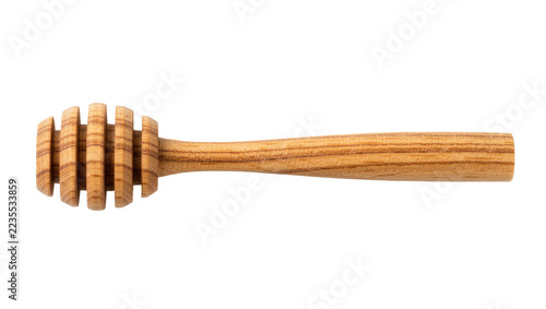 Fotografie Wooden honey dipper with grooved head and long handle