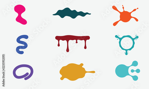 Colorful ink splatters and abstract liquid shapes set on a white background