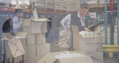 Image of financial data processing and envelope icons over diverse workers in warehouse