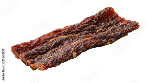 Obraz na plátně Thin strip of seasoned dried beef jerky with visible spice granules