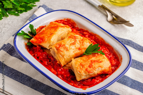 Delicious stuffed cabbage rolls served with tomato sauce