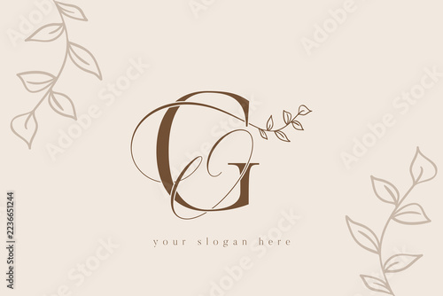Elegant GO letter monogram logo template featuring delicate hand drawn botanical foliage branches and vintage typography in sophisticated brown tones