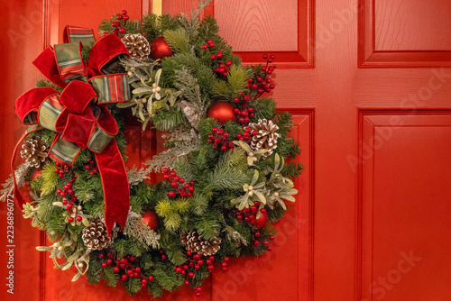 Christmas wreath on red background 