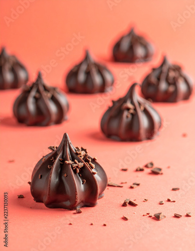 Chocolate meringue kisses dipped in dark chocolate with cocoa nib topping