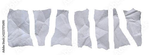 White torn paper pieces with crumpled creased texture and ragged ripped edges on transparent background