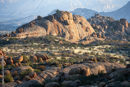 Sunlight falls on desert rocks in Namibia